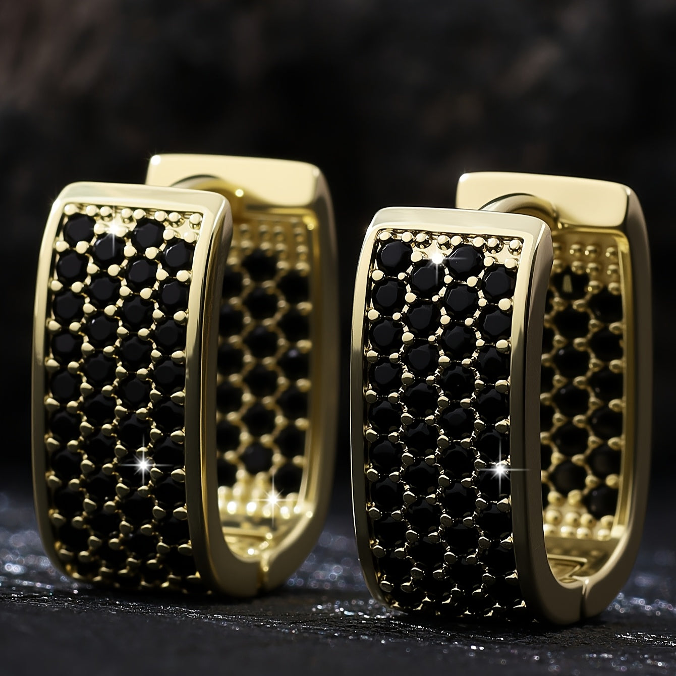 A pair of elegant, understated, and luxurious earrings featuring a U-shaped design with dense-set synthetic zirconia