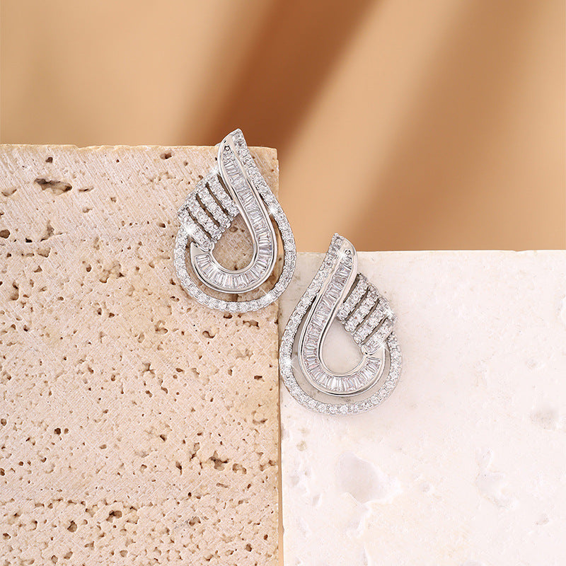 Luxurious stud earrings with fully set and ultra-shiny zirconia